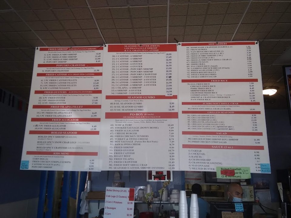 Printed menu with po’ boys and kid’s meals.