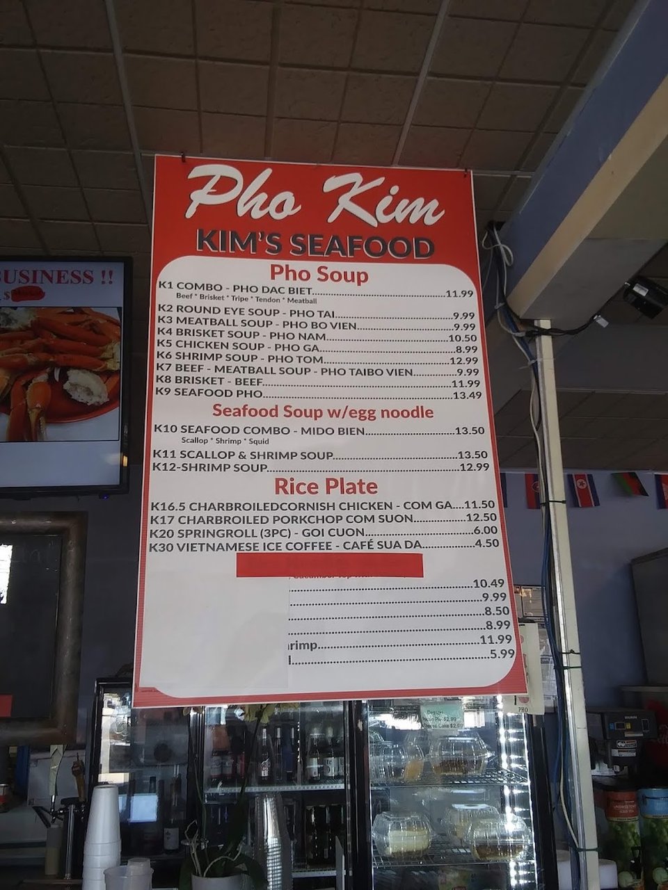 Seafood sandwich options listed on a menu board.